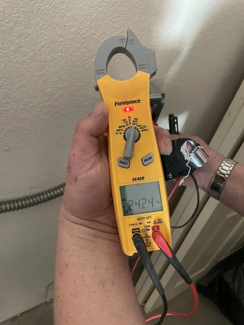 Voltage testing with clamp meter during Electrical Installation Services in Hudson